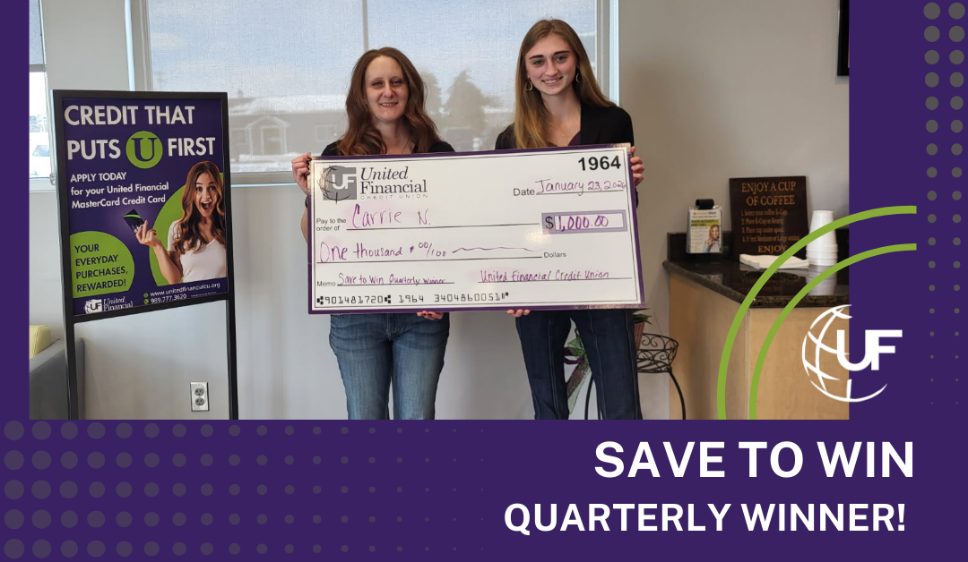 Save to Win CD winner holding $1,000 big check.